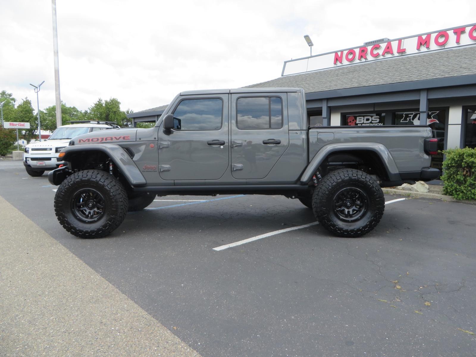 2021 Sting Grey /BLACK Jeep Gladiator Gladiator Mojave (1C6JJTEG4ML) with an 3.6L V6 engine, automatic transmission, located at 2630 Grass Valley Highway, Auburn, CA, 95603, (530) 508-5100, 38.937893, -121.095482 - Mojave Galdiator featuring a Readylift 4" suspension system, 37" Nitto Ridge Grappler tires, 17" Fuel Ammo wheels, Rugged Ridge bed cover, and window tint. - Photo #7